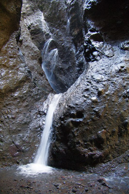 Water still gushes from the narrow gully below the Mt Rano landslide.